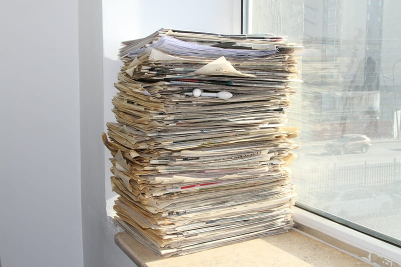 A stack of folded newspapers